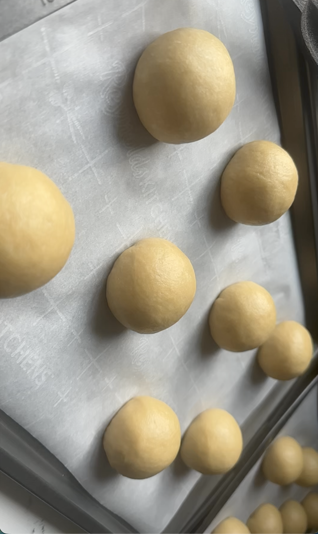 Raw bread dough rising in a rustic clay bowl